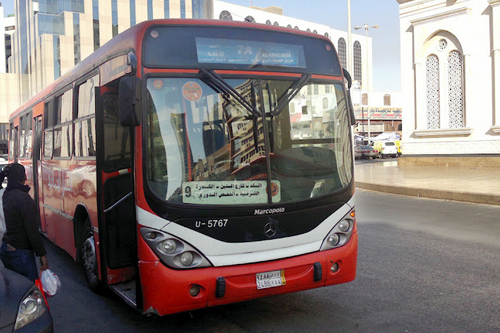 SAPTCO local service bus waiting for passengers at Balad